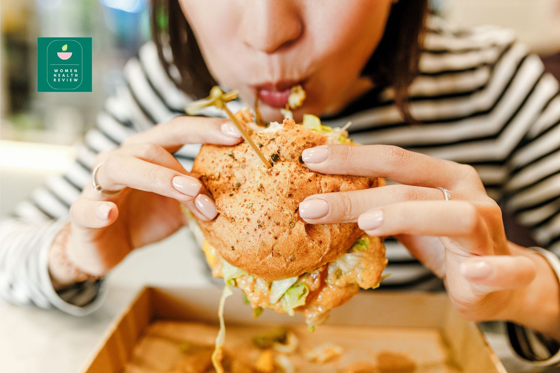 A woman eating burger