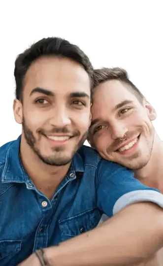 Two smiling people in a close embrace.