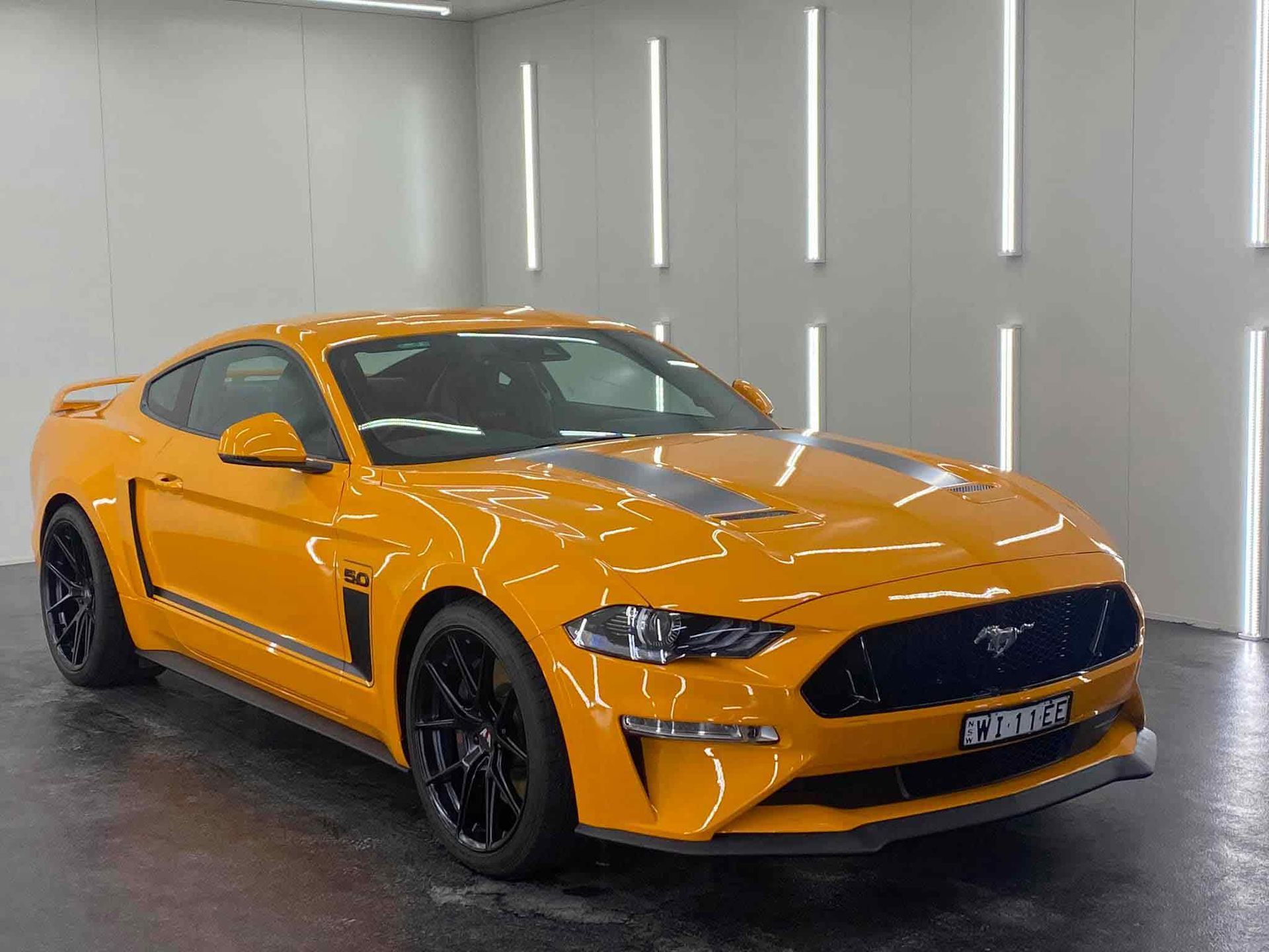 View Front Left And Yellow-Orange Car — Car Ceramic Coating in Fyshwick, ACT