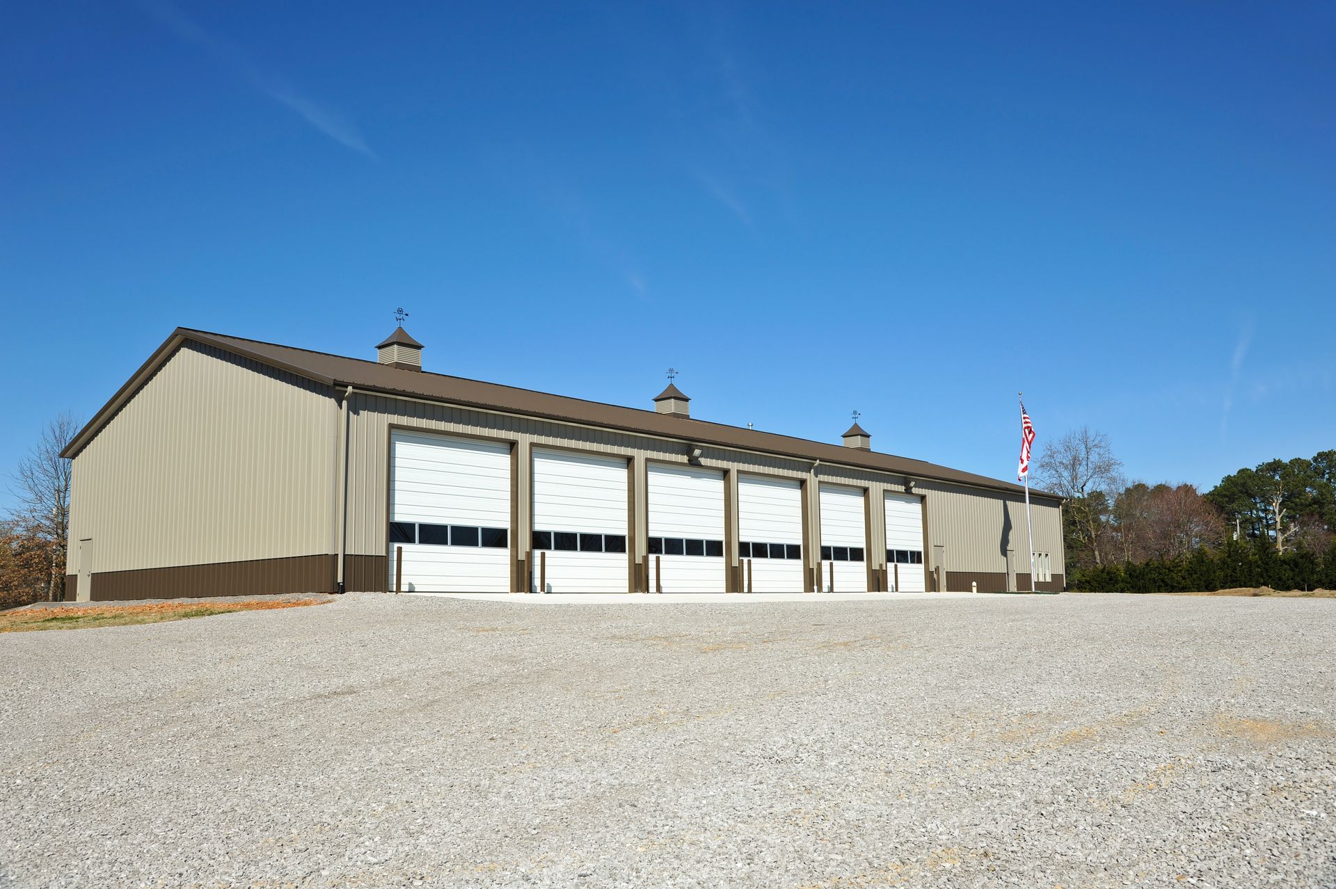 a large building with a lot of white garage doors