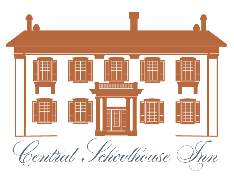 A logo for the central schoolhouse inn with a brown building