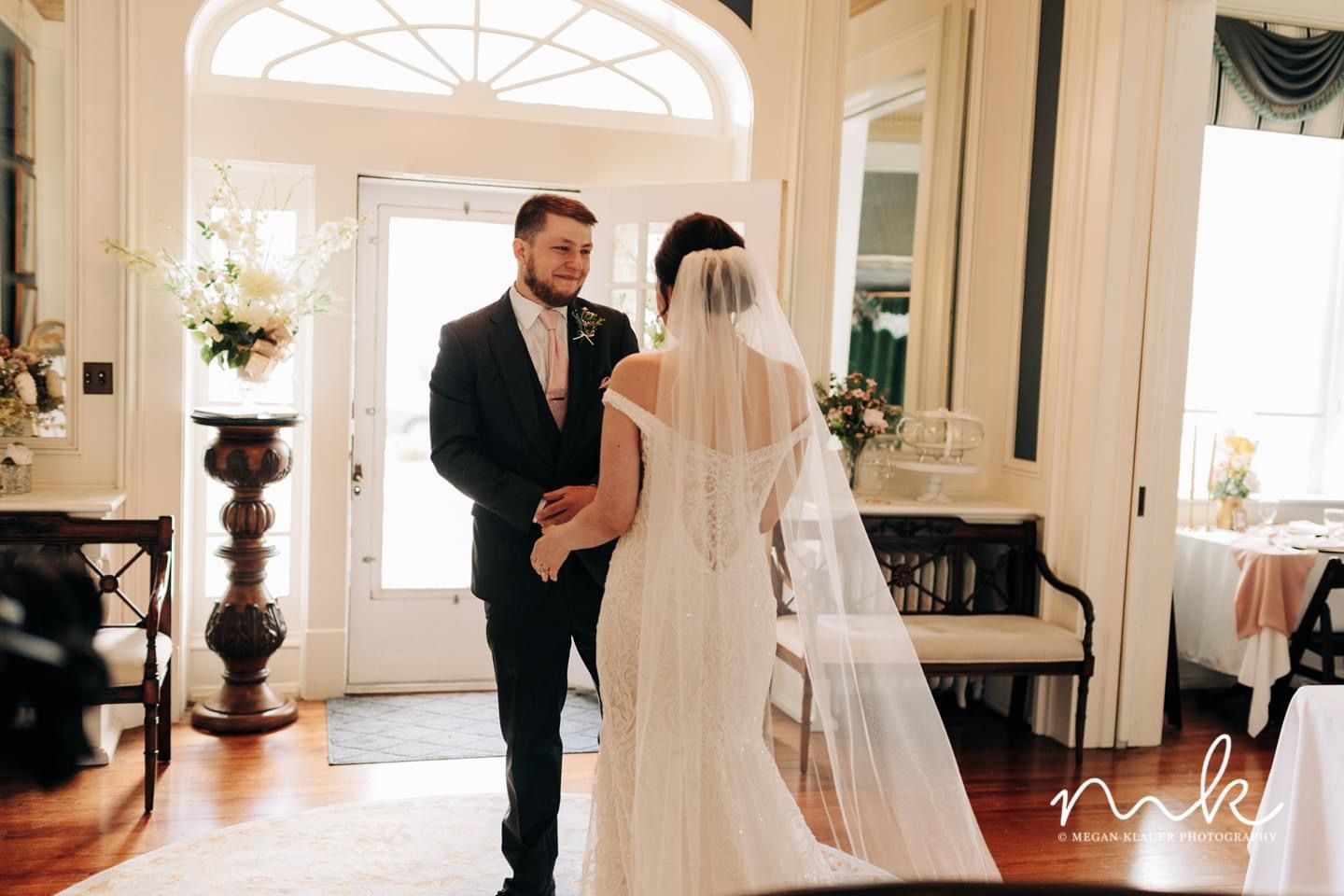 A bride and groom are walking down the aisle at their wedding.