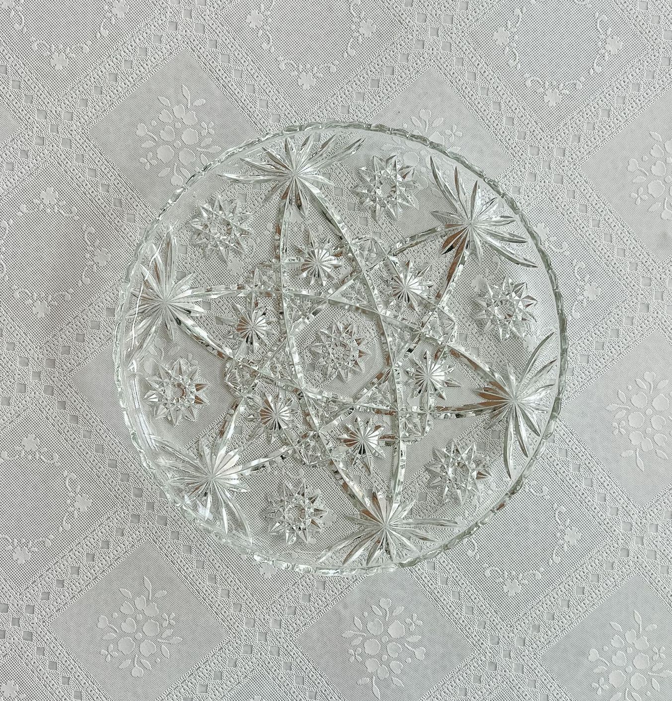 A clear glass plate on a wooden table