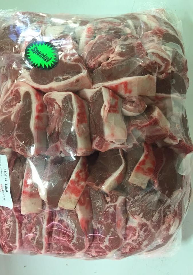 A Bag of Raw Lamb Chops Is Sitting on A Table — Holiday Coast Meat & Smallgoods in Grafton, NSW