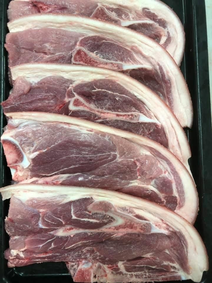 A Tray of Raw Pork Chops on A Table — Holiday Coast Meat & Smallgoods in Grafton, NSW