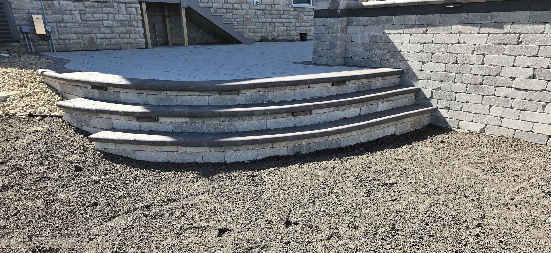 Man Building Patio — Columbus, OH — CBJ Landscape Group