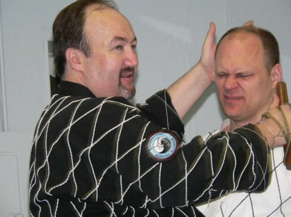 Two men are standing next to each other and one has a patch on his arm that says ' united states of america '