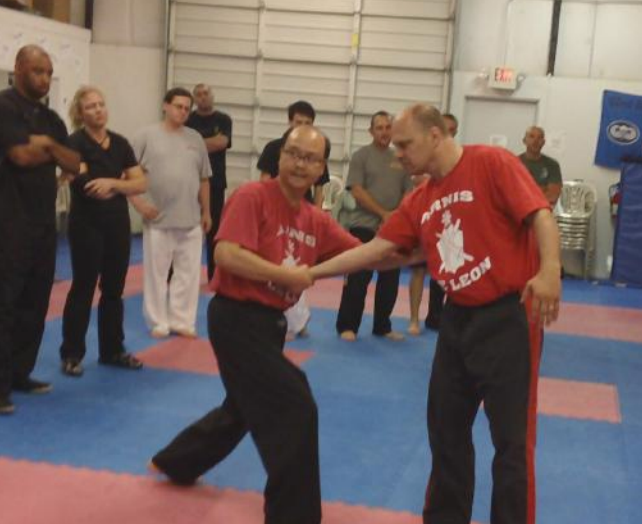 A man in a red shirt with the word leon on it