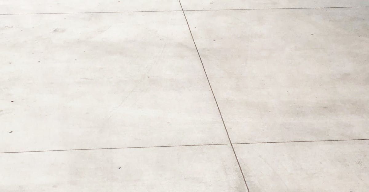 Gray concrete surface with dashed lines indicating a road.