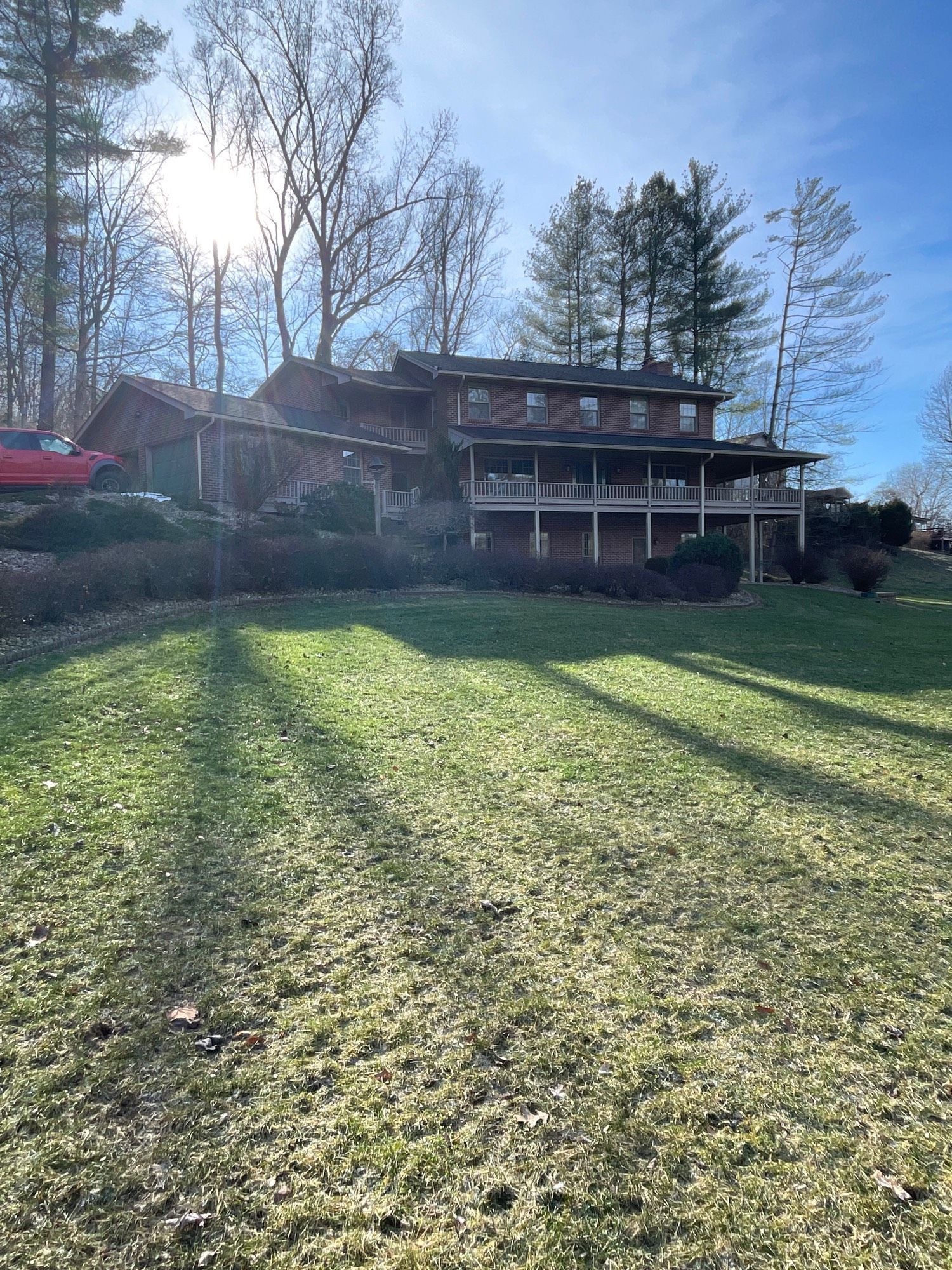 A large house with a large lawn in front of it.