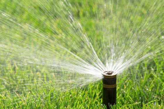 Sprinkler Design Installation — Sprinkler Releasing Water in Lehigh Acres, FL