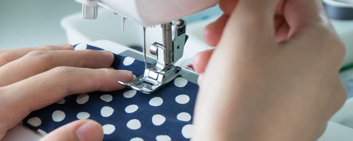White polka dot cloth being altered