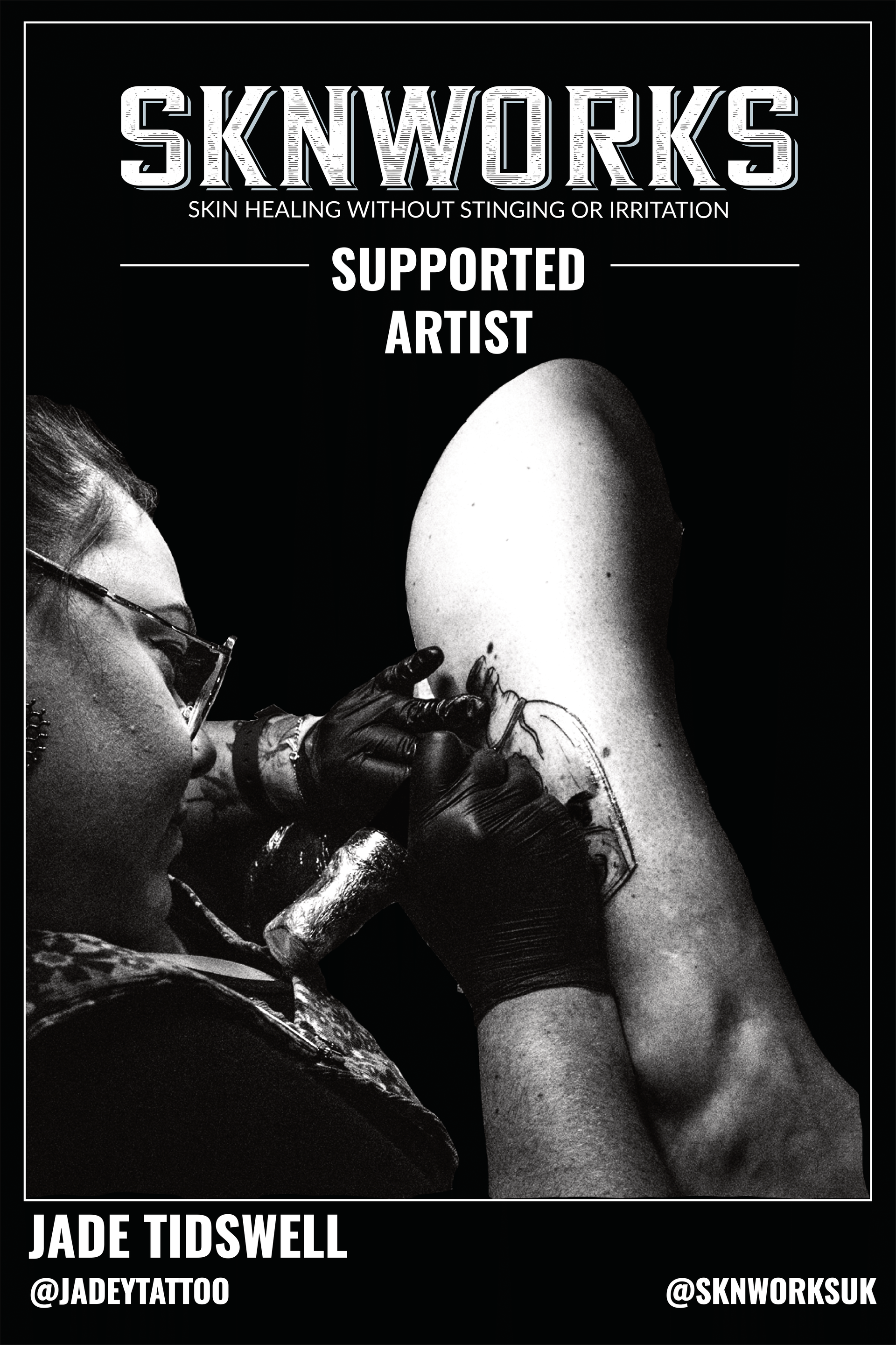 A black and white photo of a person getting a tattoo on their leg.