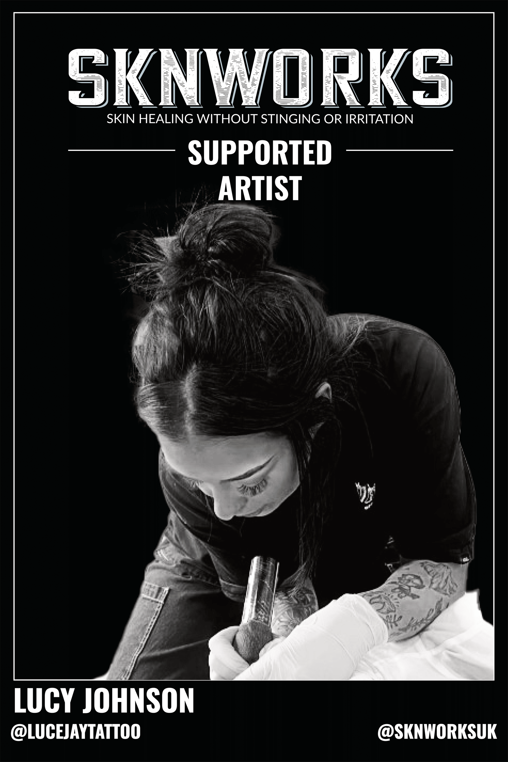 A black and white photo of a woman getting a tattoo.