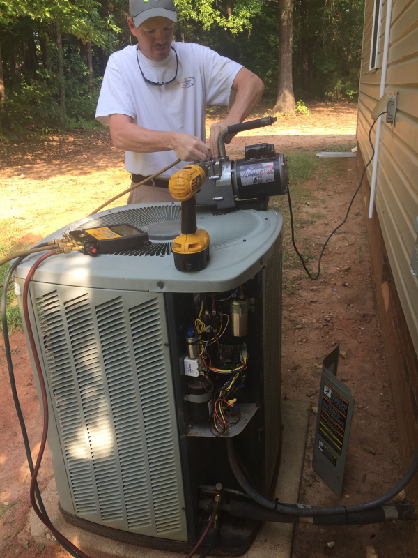 Fixing Air Conditioners 1 - Rock Hill, SC - Lighthouse Heating & Cooling Specialists Inc