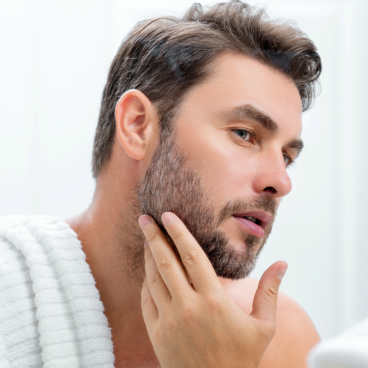 A man receiving a beauty treatment in his forehead.