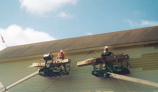 Professionals repairing a roof in New Milford, CT