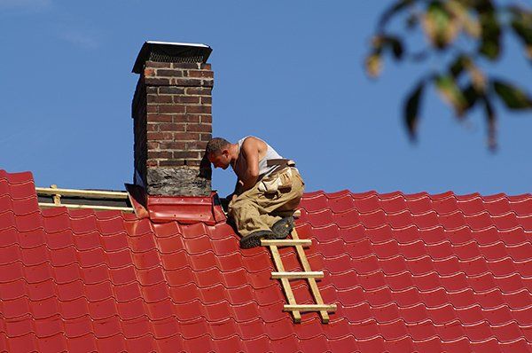 Maintenance —  Worker Repairing a Chimney in Monmouth, OR