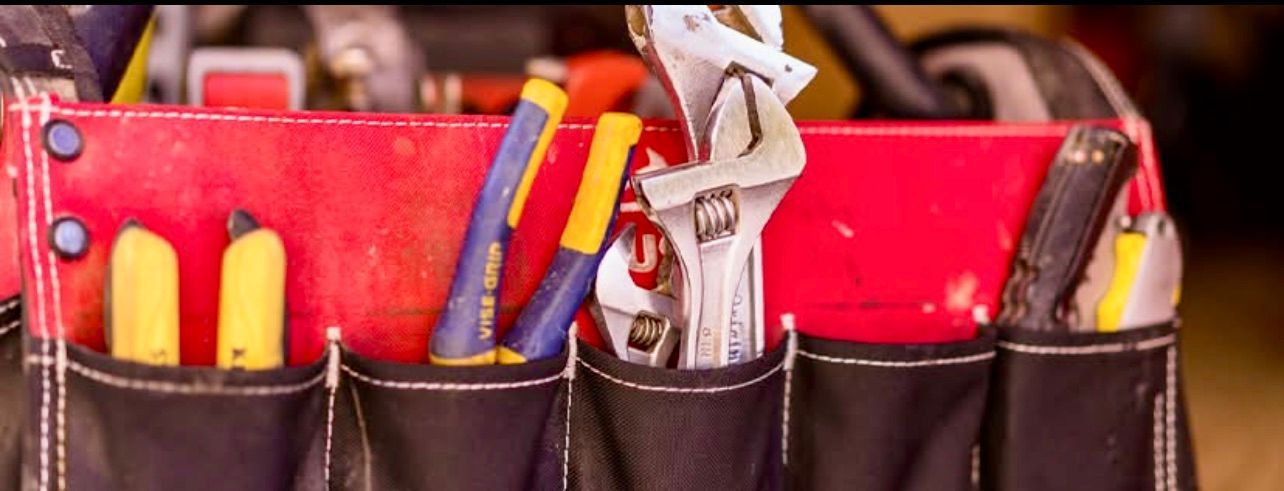 A close up of a toolbox filled with tools.