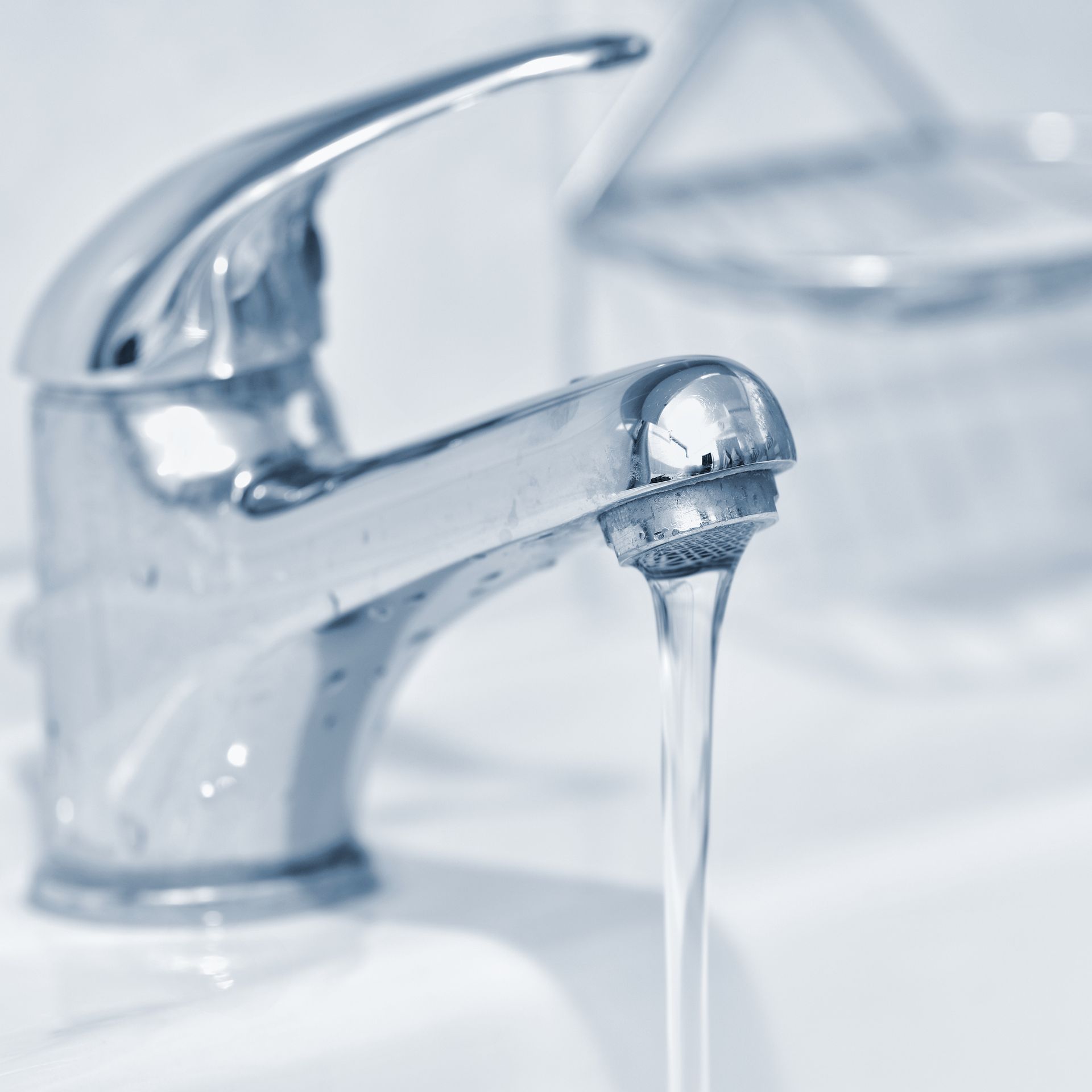 A close up of a faucet with water running out of it