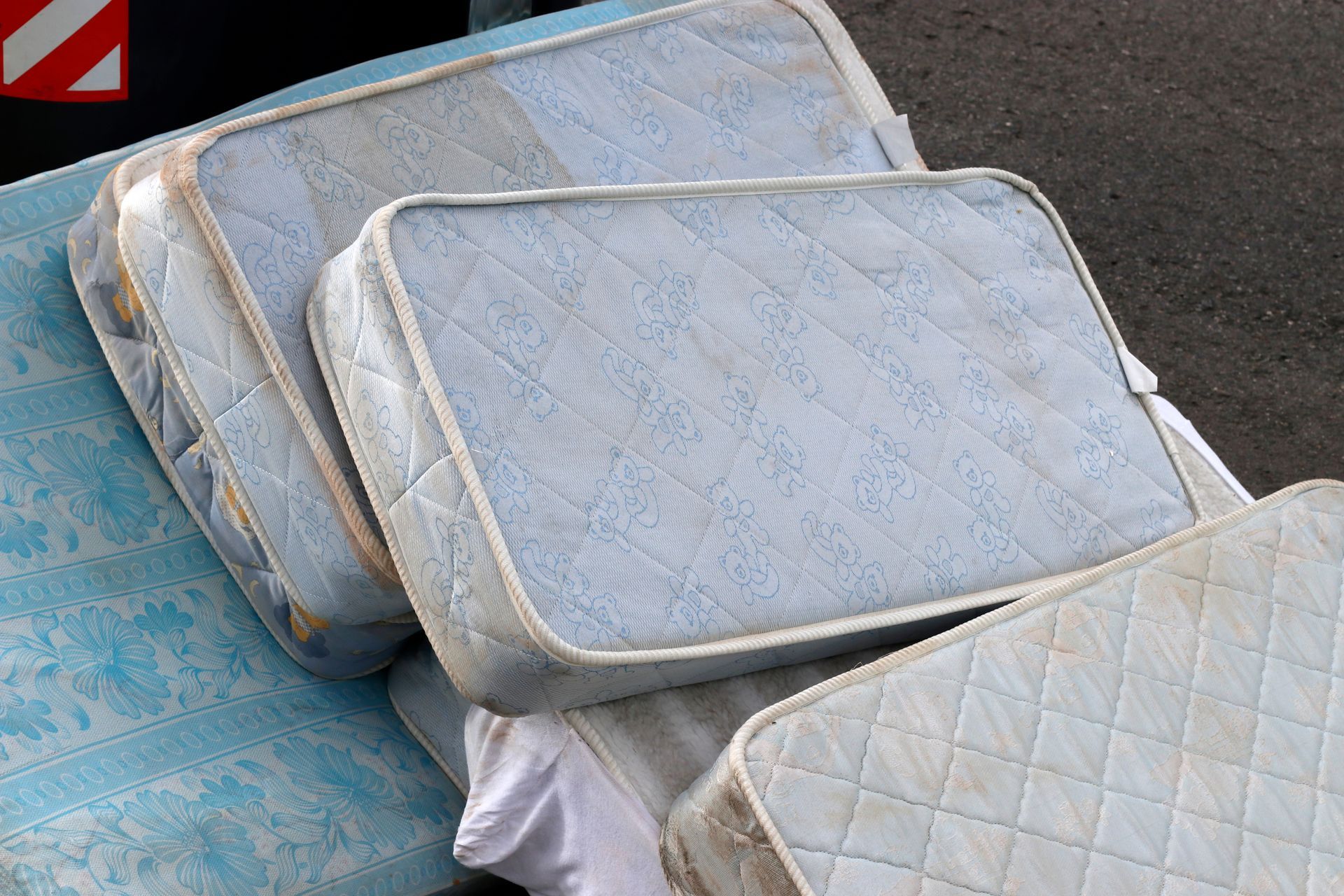 Three mattresses are stacked on top of each other