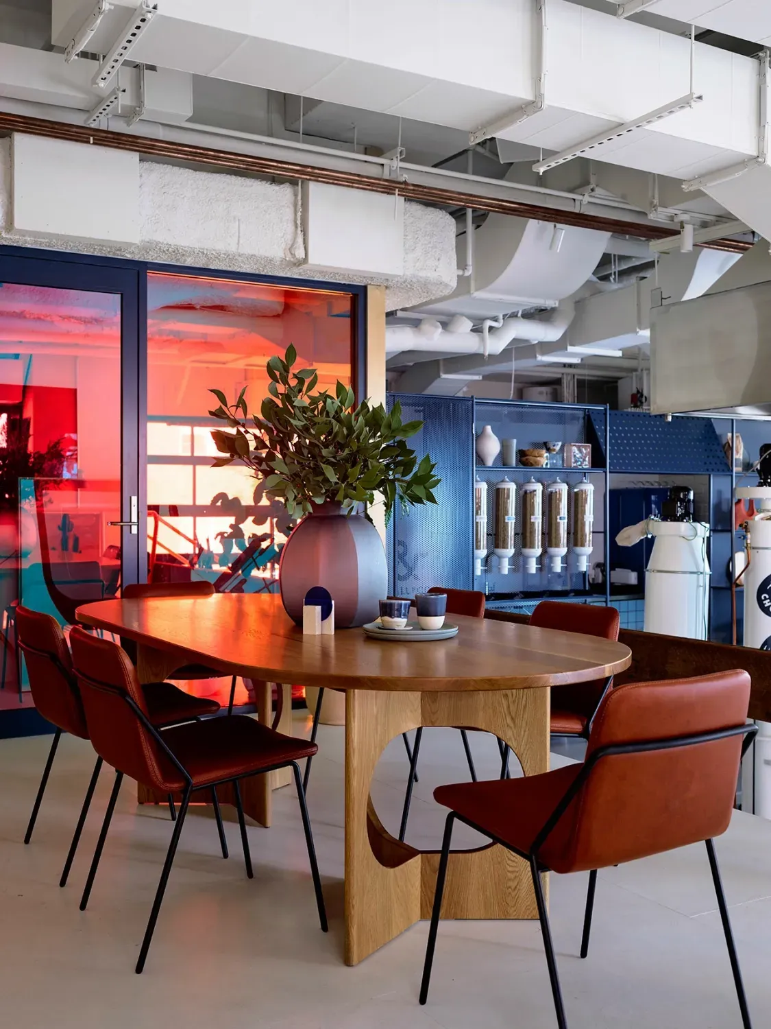 A room with a table and chairs in it