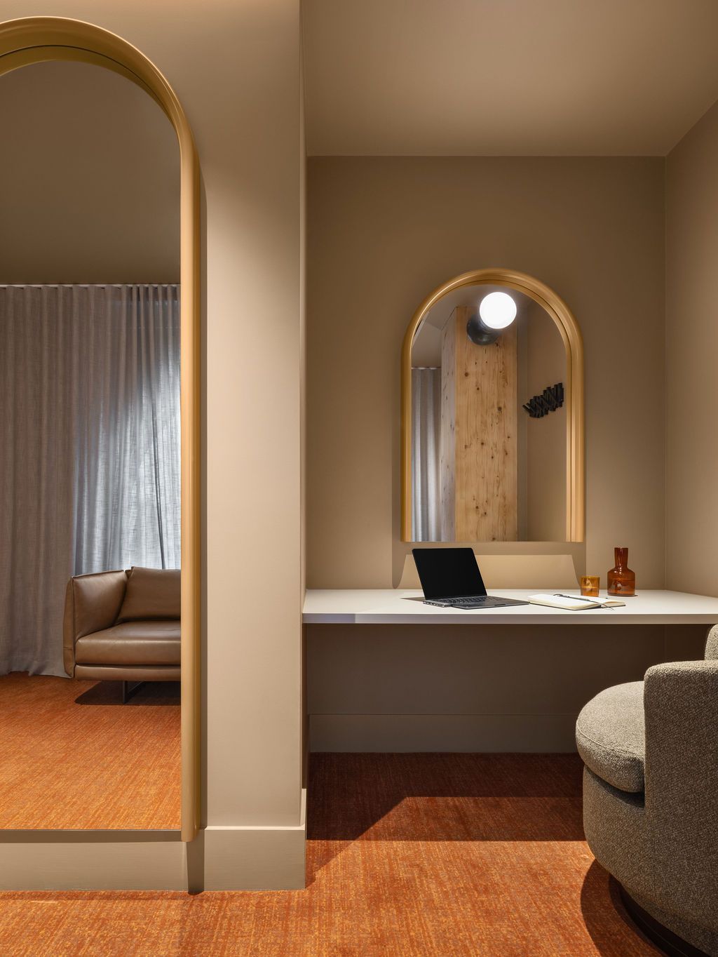 A living room with a table and chairs and a balcony