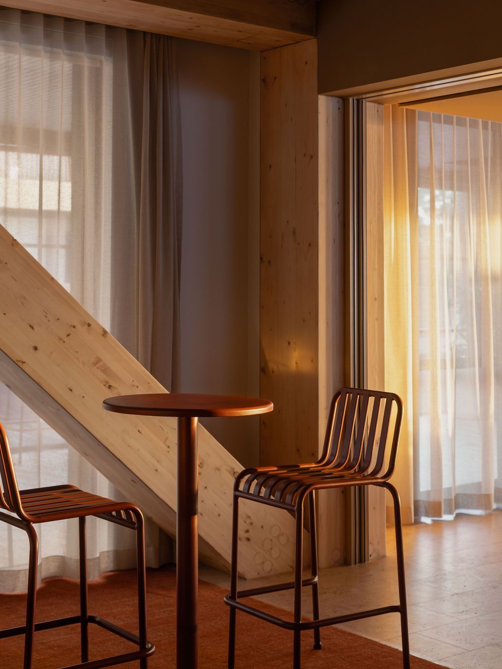 A living room with a table and chairs and a couch