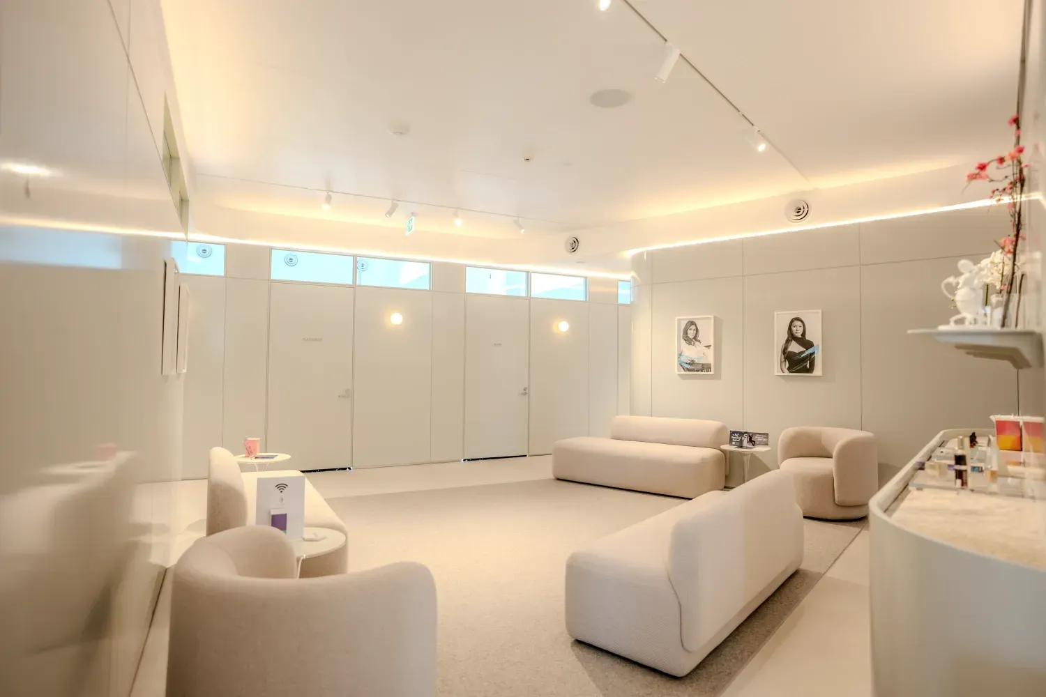 A room with a couch and chairs in it