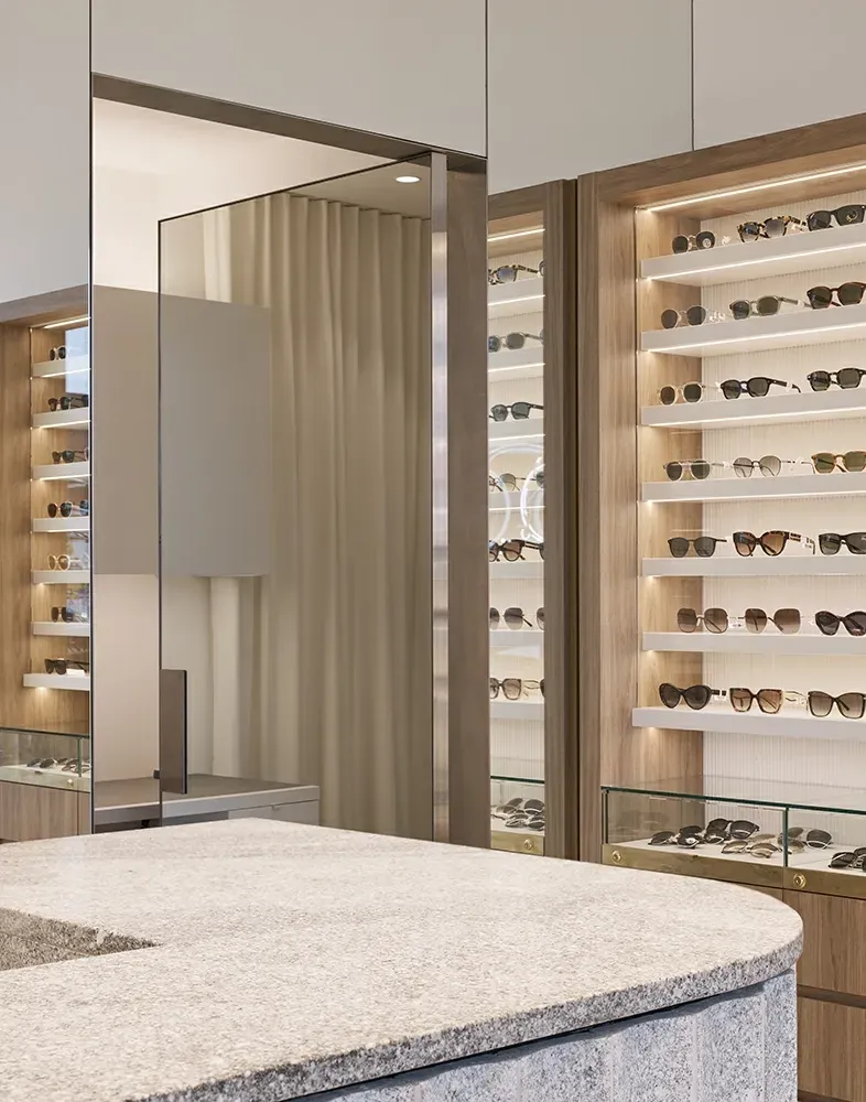 A room with a lot of shelves filled with sunglasses