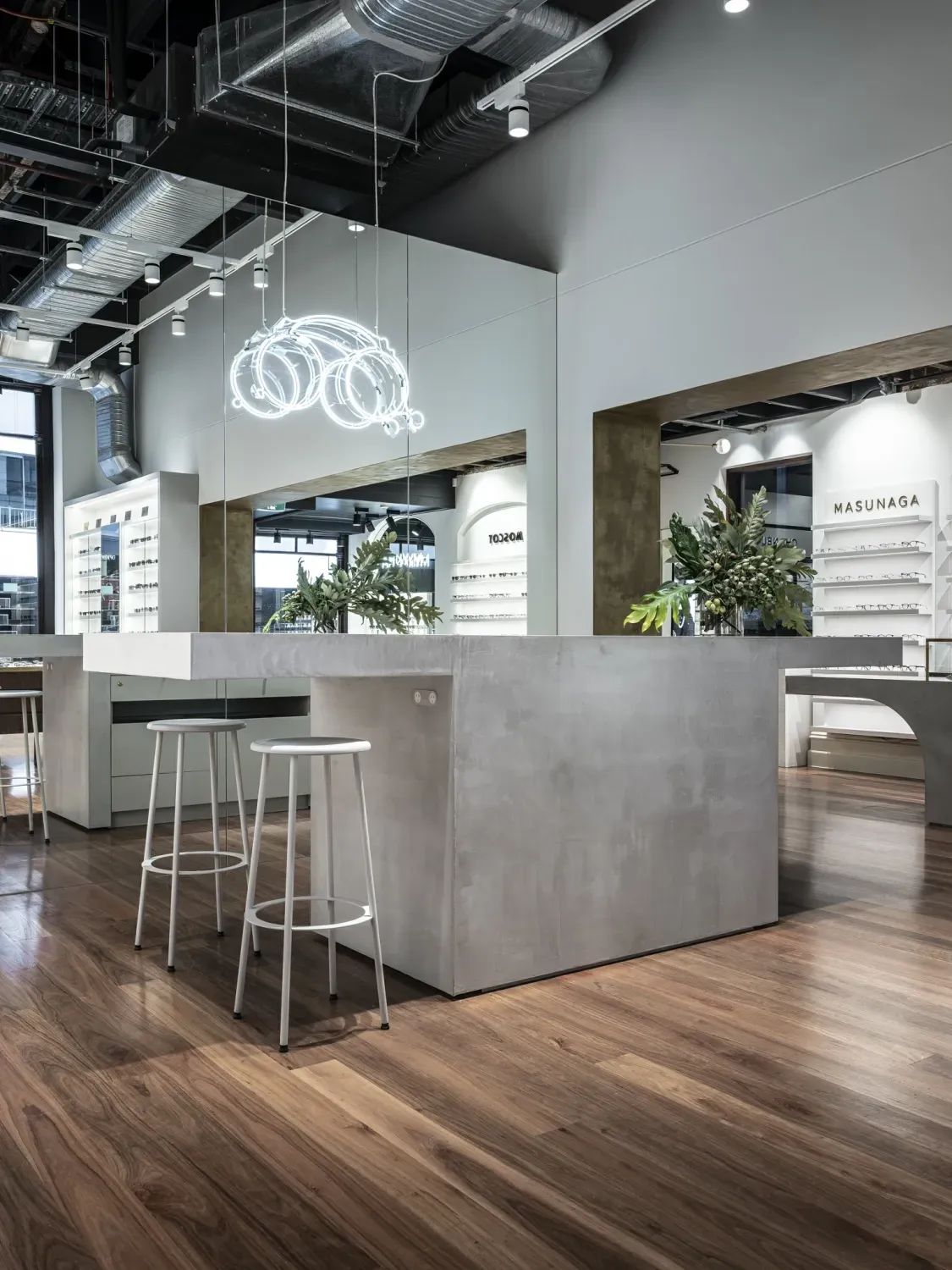 A room with a table and stools in it