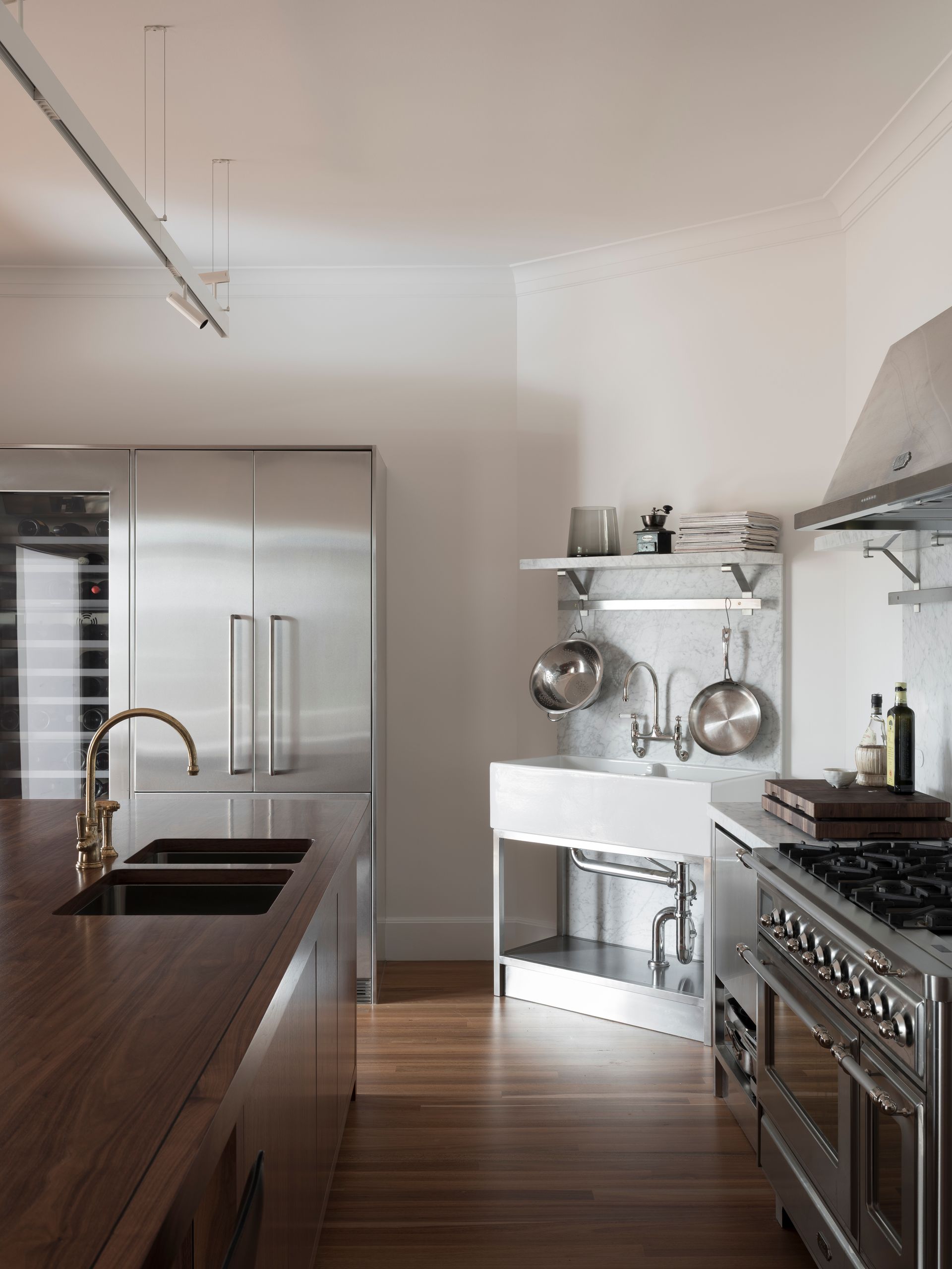 A kitchen with stainless steel appliances and a sink