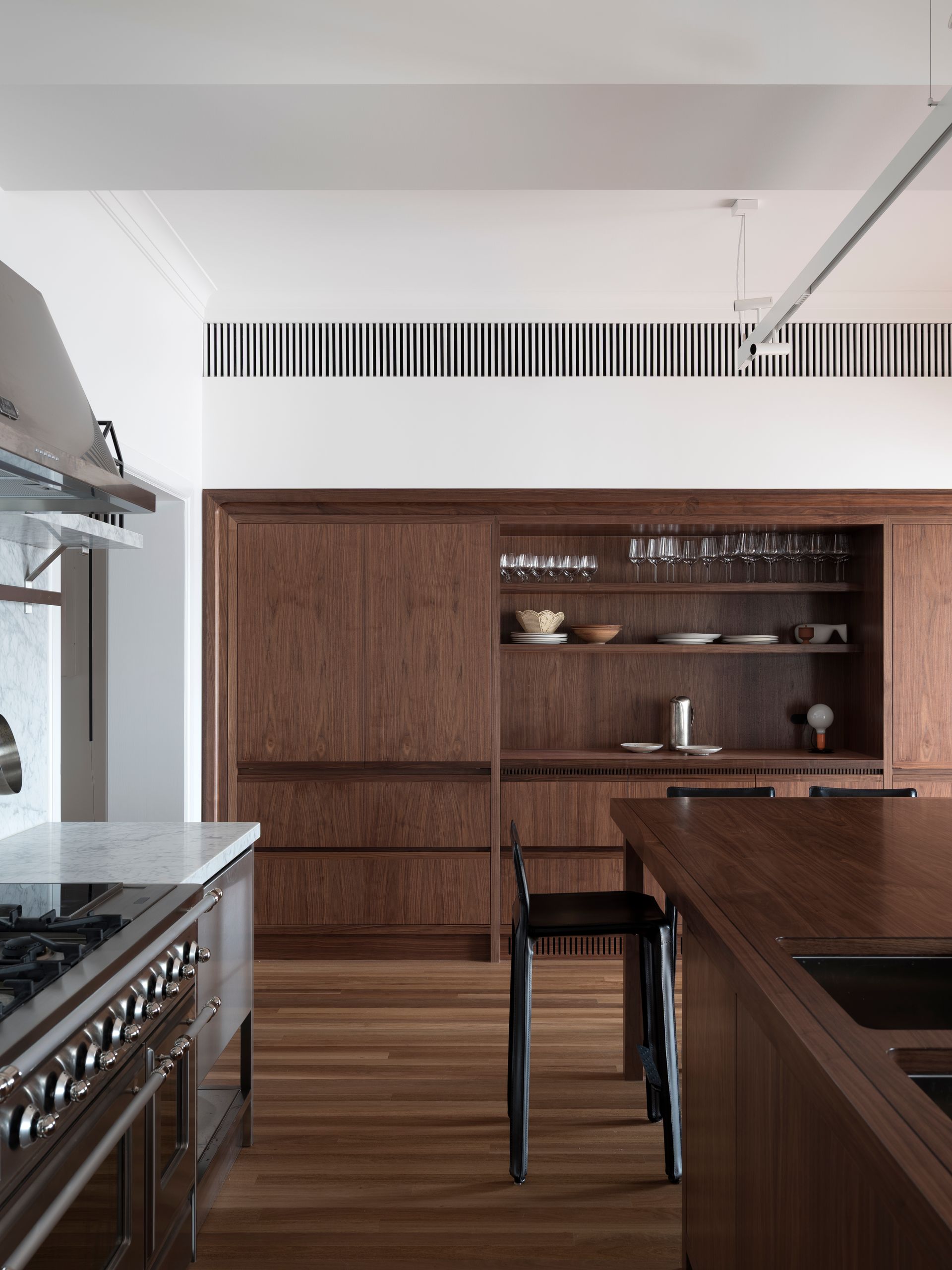 A kitchen with wooden cabinets and a stove top oven