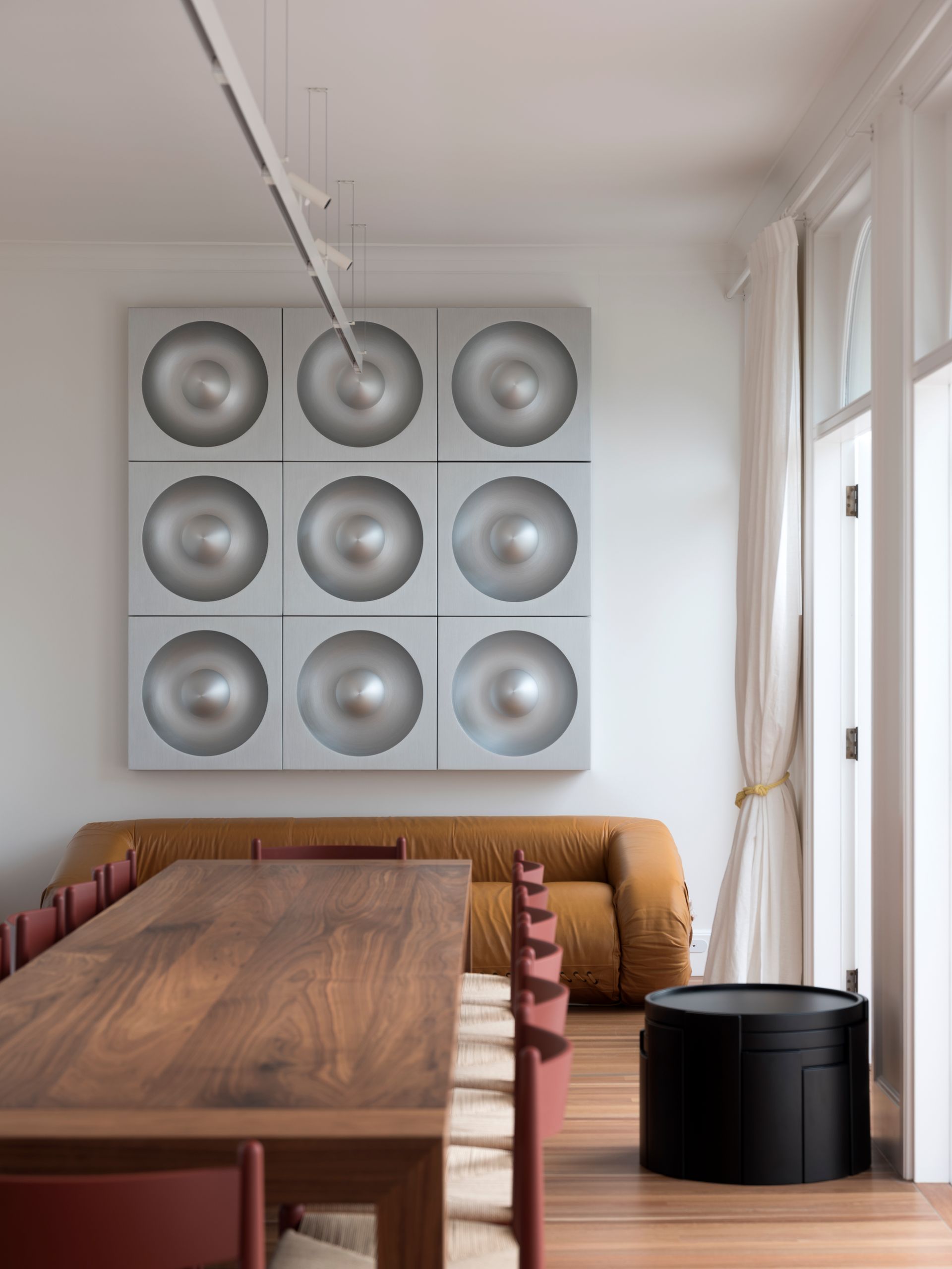 A living room with a table and chairs and a couch