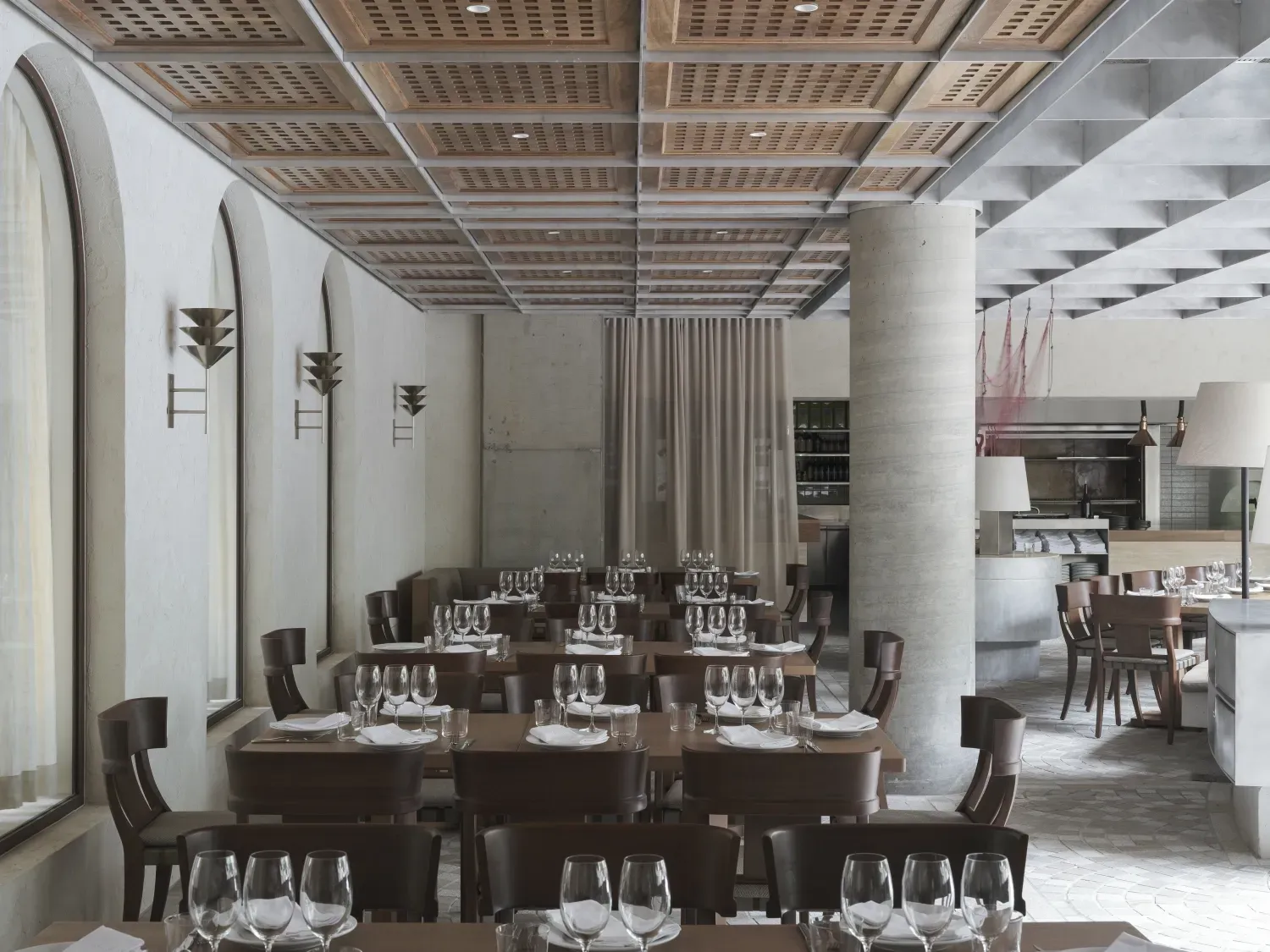 A restaurant with a lot of tables and chairs