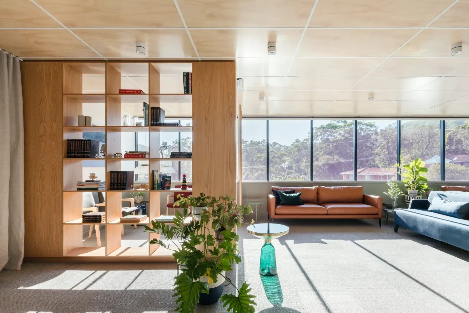 A living room with a couch and a bookshelf
