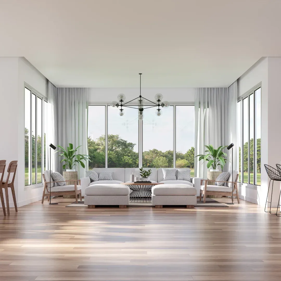 A living room with a lot of windows and furniture.