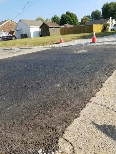 Freshly paved asphalt road surface.
