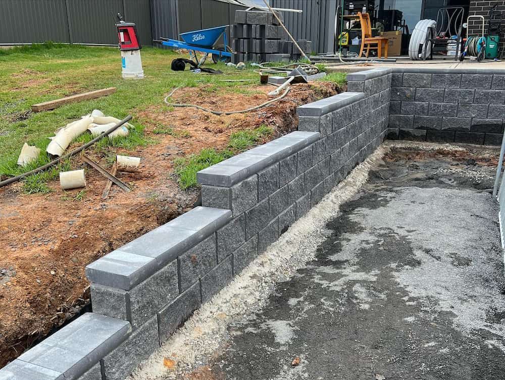 Sandstone Black Retaining Walls — Creative Spaces Landscaping in Dubbo, NSW