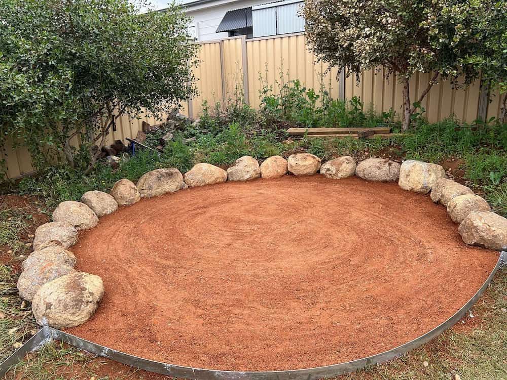 A Granite Boulder Fire Pit — Creative Spaces Landscaping in Dubbo, NSW
