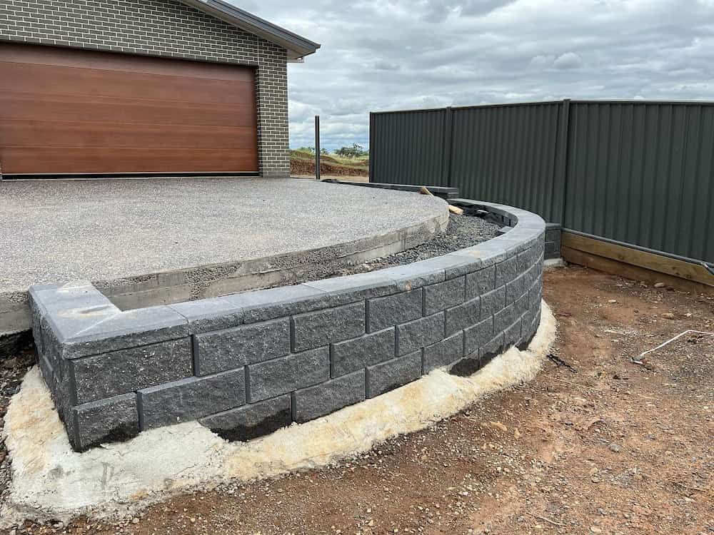 Charcoal Retaining Wall — Creative Spaces Landscaping in Dubbo, NSW