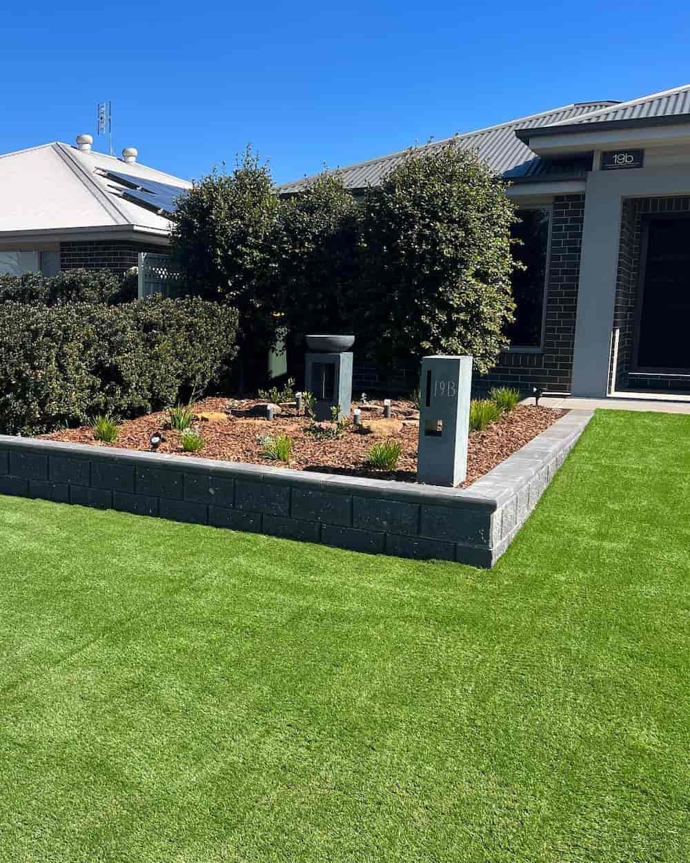 A House with A Lush Green Lawn in Front of It — Creative Spaces Landscaping in Dubbo, NSW