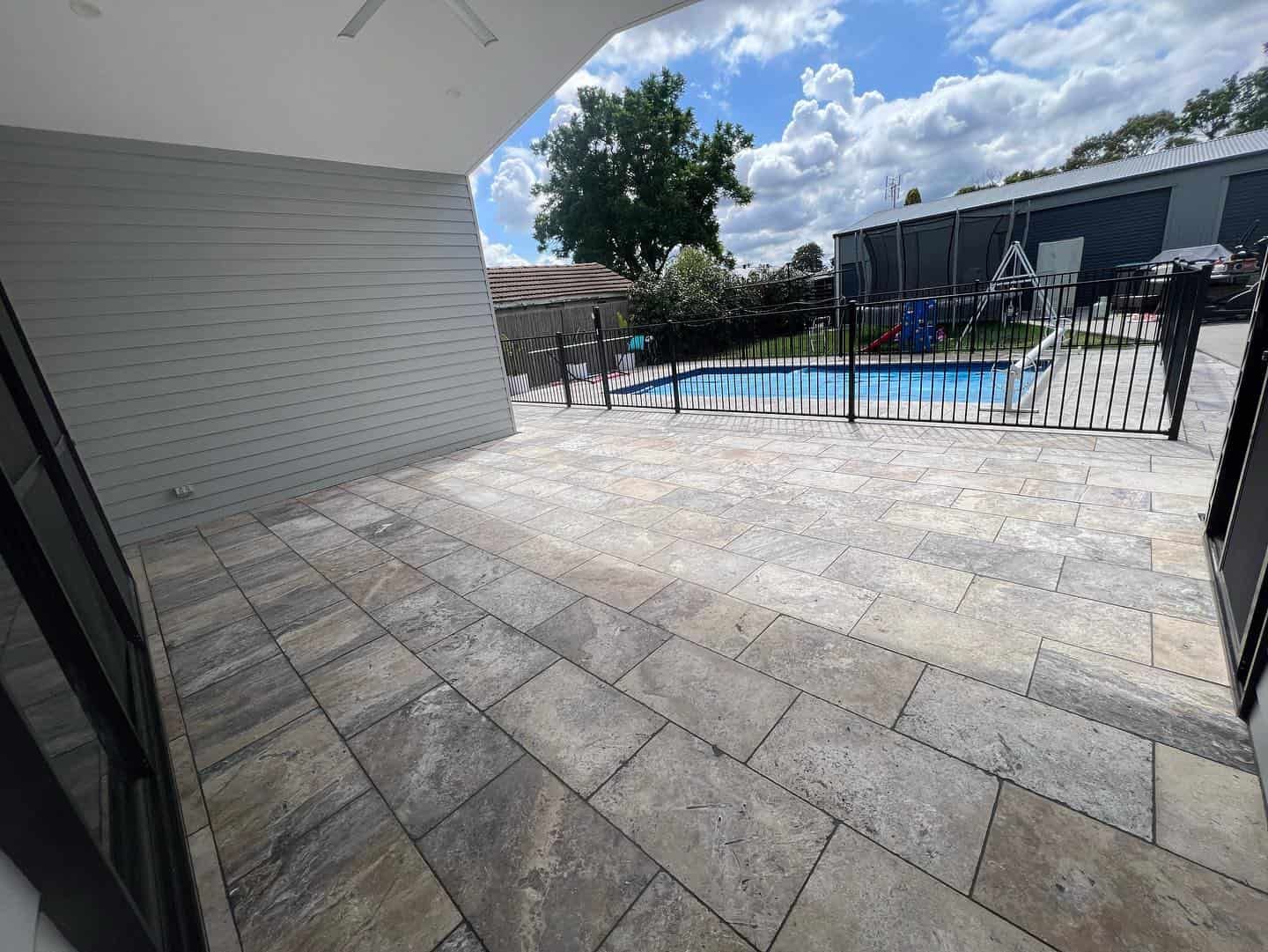 A Swimming Pool in The Backyard of A House — Creative Spaces Landscaping in Dubbo, NSW
