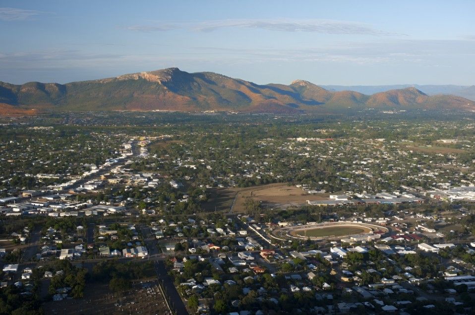 An Aerial View of a City With Mountains in the Background — FNQ Professional Cleaning Services In Mount Sheridan, QLD