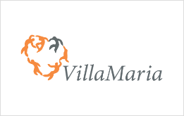 Logo di VillaMaria, un simbolo a forma di cuore composto da figure arancioni e grigie, accanto al testo.