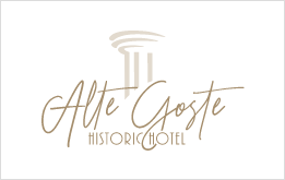 Logo per l'Alte Groste Historic Hotel: icona a colonna sopra un elegante testo in corsivo.