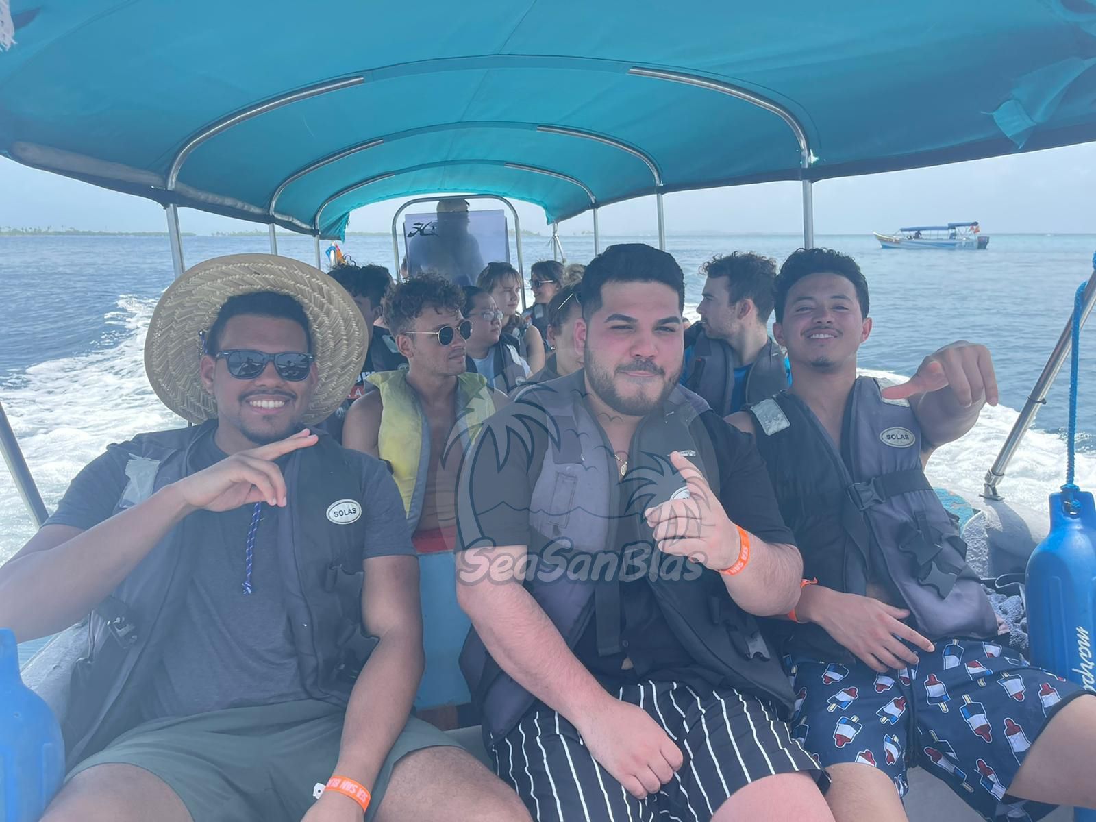 a group of people on a boat with seasanbias written on the bottom
