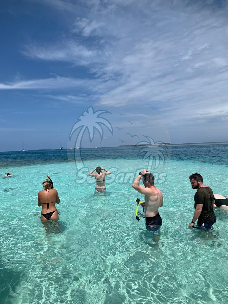 A group of people are swimming in the ocean. San Blas Islands Guna Yala San Blas Tours
