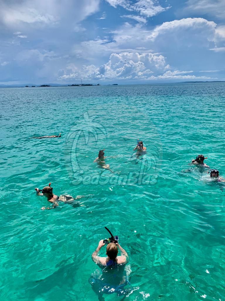 A group of people are swimming in the ocean. San Blas Islands Guna Yala San Blas Tours