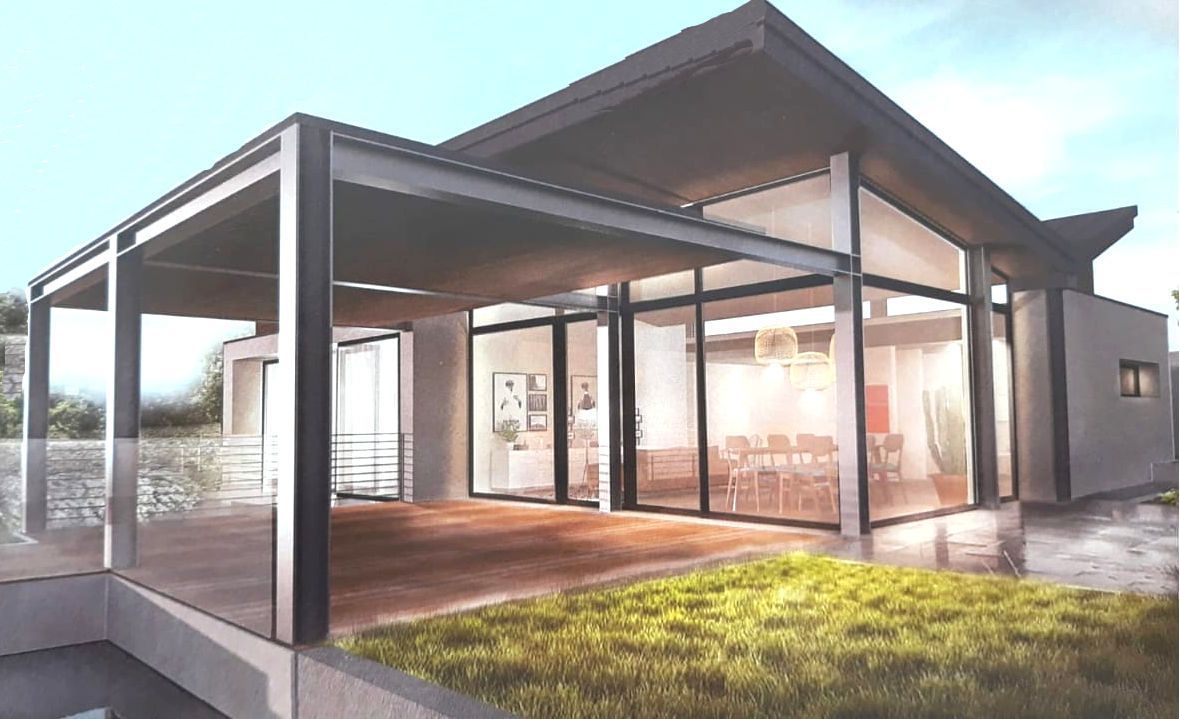 Rappresentazione artistica di una casa moderna con molte finestre.